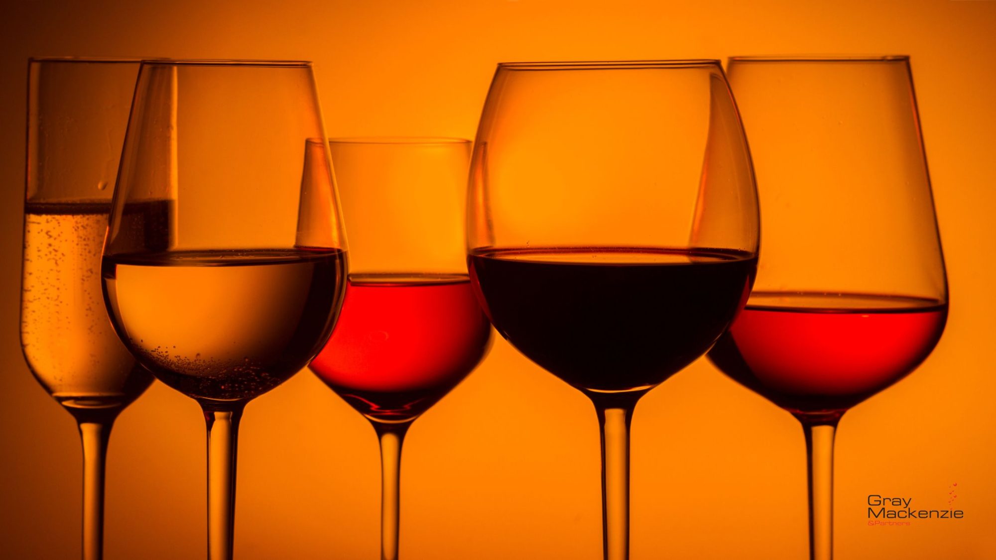 Different types of glasses containing red wine, white wine, sparkling.
